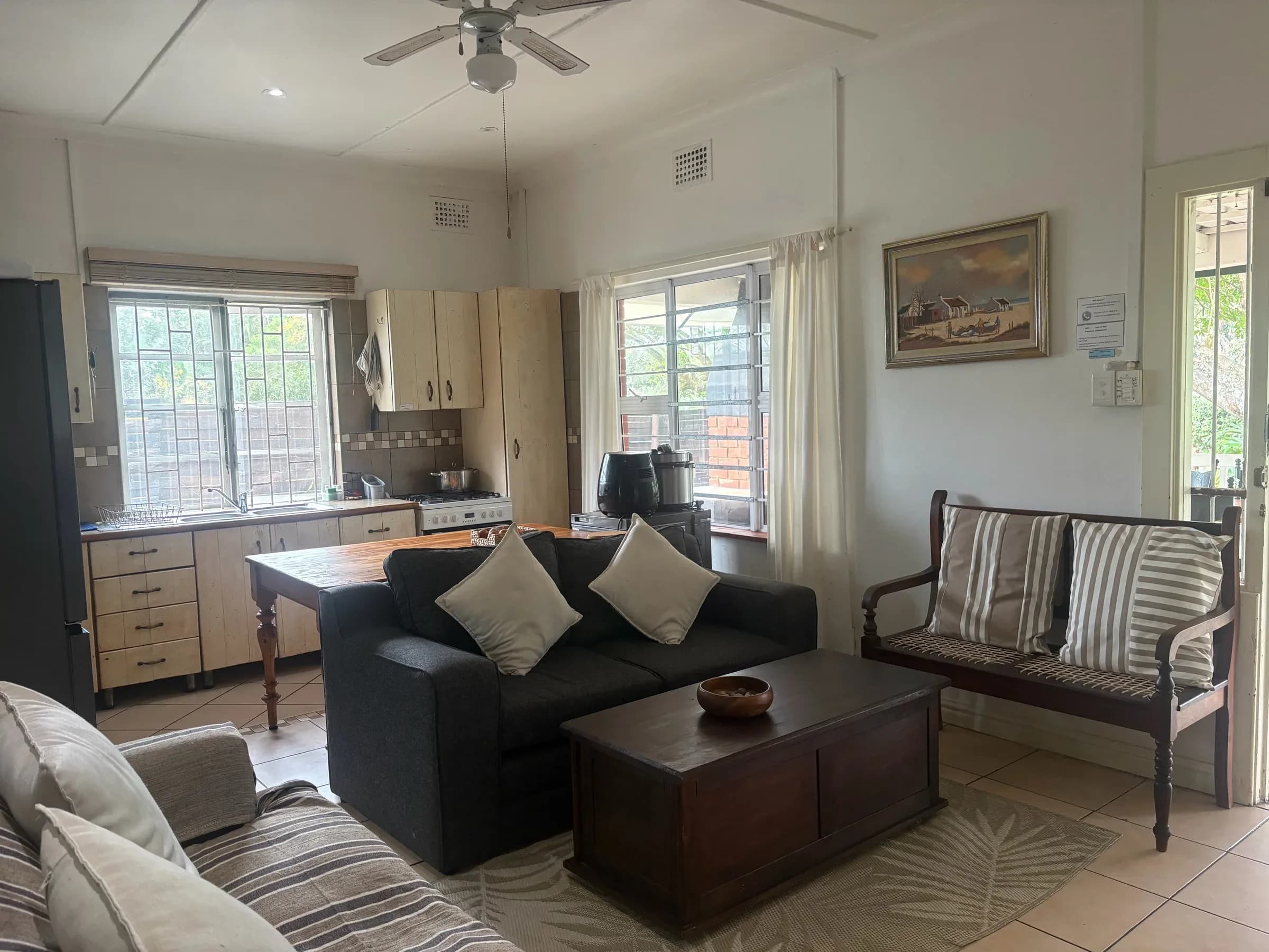 Open-plan lounge with leather couches